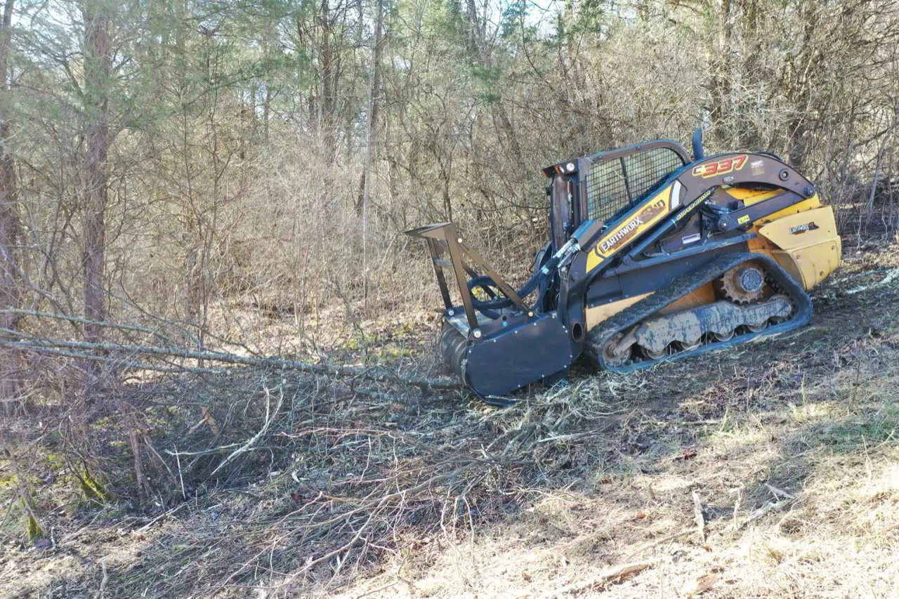 Mulcher working through thick brush