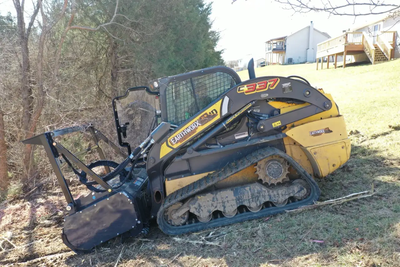 EarthWorx compact track loader with forestry mulcher in Northern Kentucky